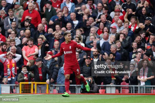 Roberto Firmino of Liverpool celebrates after scoring their sides first goal during the Premier League match between Liverpool FC and Brighton & Hove...