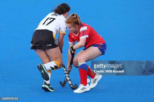 Annie Gibbs of the Perth Thunder Sticks and Erin Cameron of the Adelaide Fire during the round one Hockey One League match between Perth...