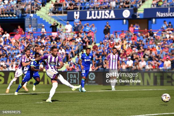 Sergio Leon of Real Valladolid CF scores their team's first goal from the penalty spot during the LaLiga Santander match between Getafe CF and Real...