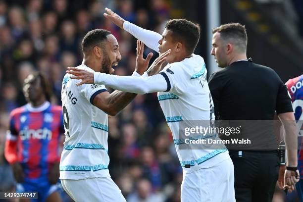 Pierre-Emerick Aubameyang of Chelsea celebrates with teammate Thiago Silva after scoring their team's first goal during the Premier League match...