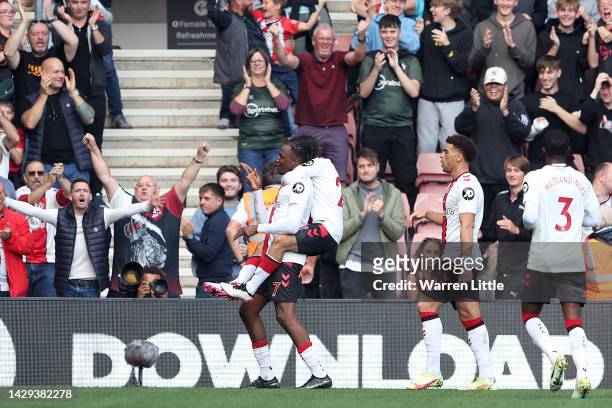Joe Aribo of Southampton celebrates with teammates after scoring their team's first goal during the Premier League match between Southampton FC and...