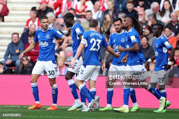 Conor Coady of Everton celebrates with teammates after scoring their team's first goal during the Premier League match between Southampton FC and...