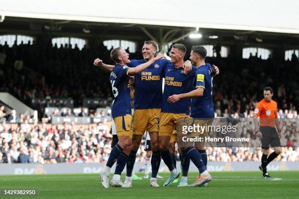 Sean Longstaff of Newcastle United celebrate with team mates Dan Burn, Sven Botman and Fabian Schar after scoring their sides third goal during the...