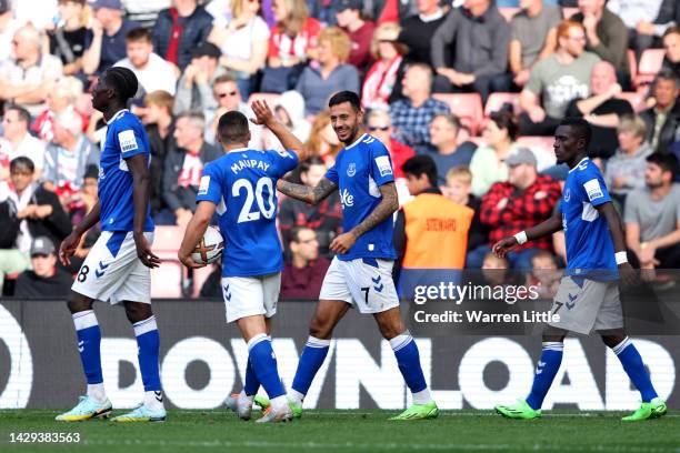 Dwight McNeil of Everton celebrates with teammate Neal Maupay after scoring their team's second goal during the Premier League match between...