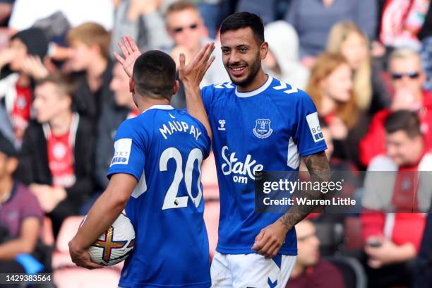 Dwight McNeil of Everton celebrates with teammate Neal Maupay after scoring their team's second goal during the Premier League match between...