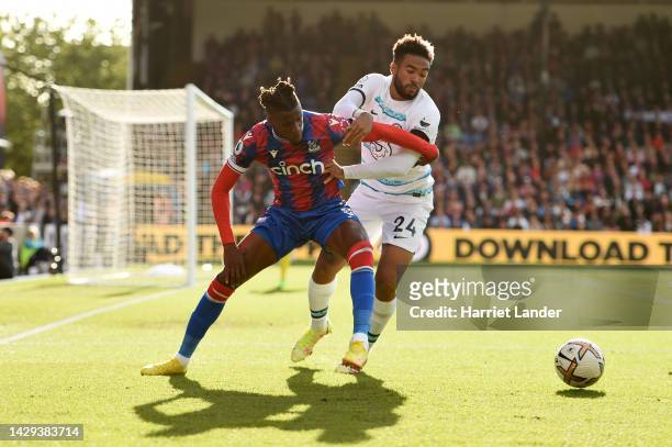 Wilfried Zaha of Crystal Palace battles for possession with Reece James of Chelsea during the Premier League match between Crystal Palace and Chelsea...