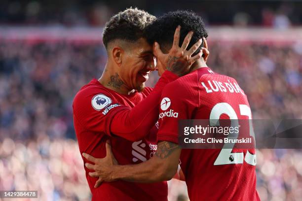 Roberto Firmino of Liverpool celebrates with team mate Luis Diaz after scoring their sides second goal during the Premier League match between...