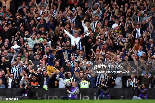 Miguel Almiron of Newcastle United celebrates after scoring their sides fourth goal during the Premier League match between Fulham FC and Newcastle...