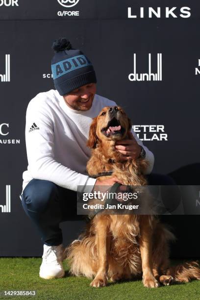 Richard Mansell of England poses with their dog, Arnie, after their round on Day Three of the Alfred Dunhill Links Championship at Carnoustie Golf...