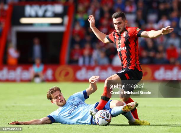 Mathias Jensen of Brentford battles for possession with Lewis Cook of AFC Bournemouth during the Premier League match between AFC Bournemouth and...