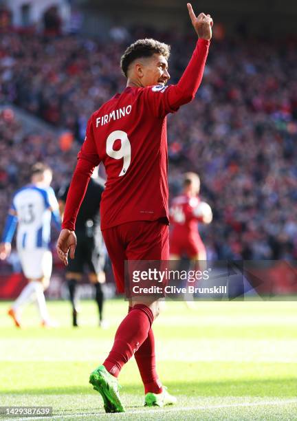 Roberto Firmino of Liverpool celebrates after scoring their sides second goal during the Premier League match between Liverpool FC and Brighton &...