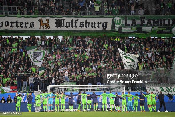 Players of VfL Wolfsburg celebrate towards the fans following their side's victory in the Bundesliga match between VfL Wolfsburg and VfB Stuttgart at...