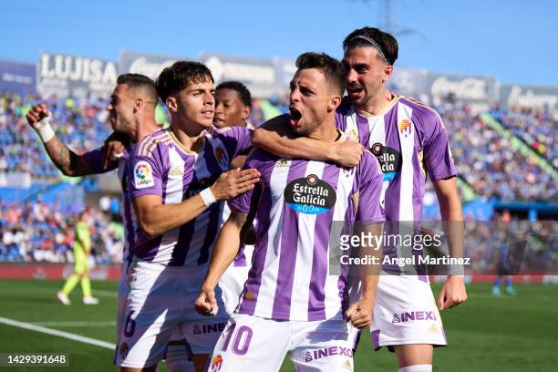 Oscar Plano of Real Valladolid celebrates with teammates after scoring their side's third goal during the LaLiga Santander match between Getafe CF...