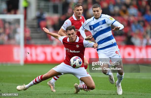 Kal Naismith of Bristol City battles for the ball with Lyndon Dykes of Queens Park Rangers during the Sky Bet Championship between Bristol City and...