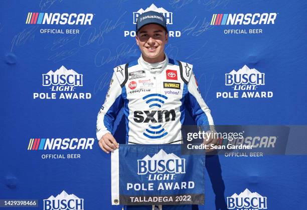 Christopher Bell, driver of the Sirius XM Toyota, poses for photos after winning the pole award during qualifying for the NASCAR Cup Series YellaWood...