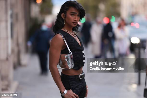 Bretman Rock seen wearing a black vest, black pants and a belt and a silver shiny handbag outside Alessandra Rich during Pariser Fashion Week on...