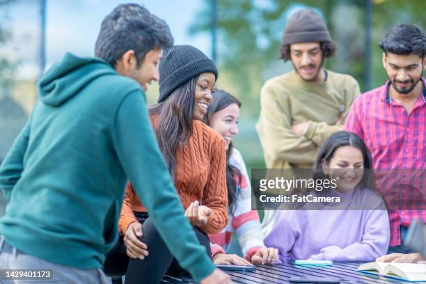 university students on break outside - spanish and portuguese ethnicity stock pictures, royalty-free photos & images