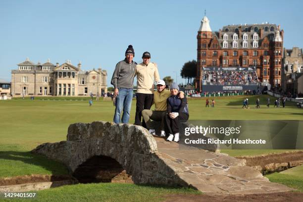 Matthew Fitzpatrick and Alex Fitzpatrick of England pose their mother and father Susan and Russell Fitzpatrick, on the Swilcan Bridge on Day Three of...