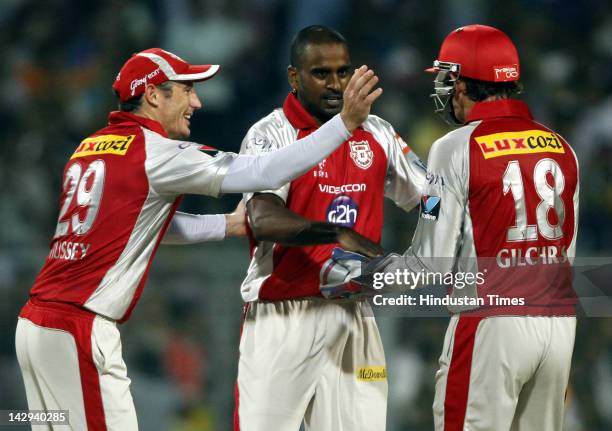 Kings XI Punjab bowler Dimtri Mascarenhas celebrating with teammates after the dismissal of Kolkata Knight Riders batsman Gautam Gambhir during the...