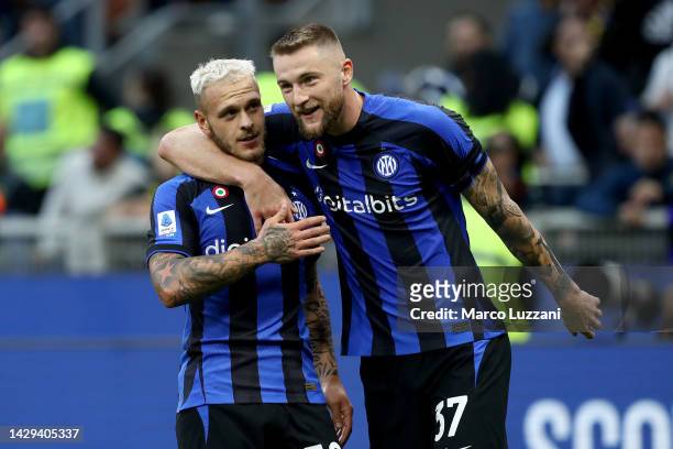Federico Dimarco of FC Internazionale celebrates with teammate Milan Skriniar after scoring their team's first goal during the Serie A match between...