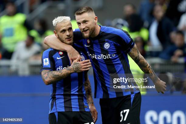 Federico Dimarco of FC Internazionale celebrates with teammate Milan Skriniar after scoring their team's first goal during the Serie A match between...