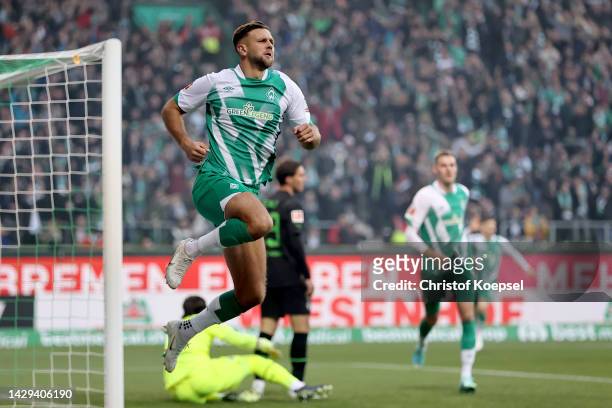Niclas Fullkrug of Werder Bremen celebrates after scoring their team's first goal during the Bundesliga match between SV Werder Bremen and Borussia...