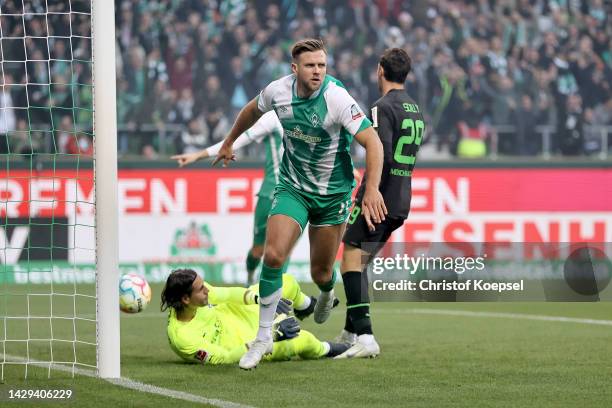 Niclas Fullkrug of Werder Bremen celebrates after scoring their team's first goal during the Bundesliga match between SV Werder Bremen and Borussia...