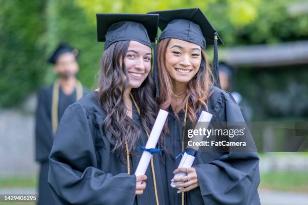 portrait of university graduates - secondary school certificate stock pictures, royalty-free photos & images