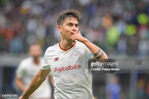 Paulo Dybala of AS Roma celebrates after scored the first goal for his team during the Serie A match between FC Internazionale and AS Roma at Stadio...