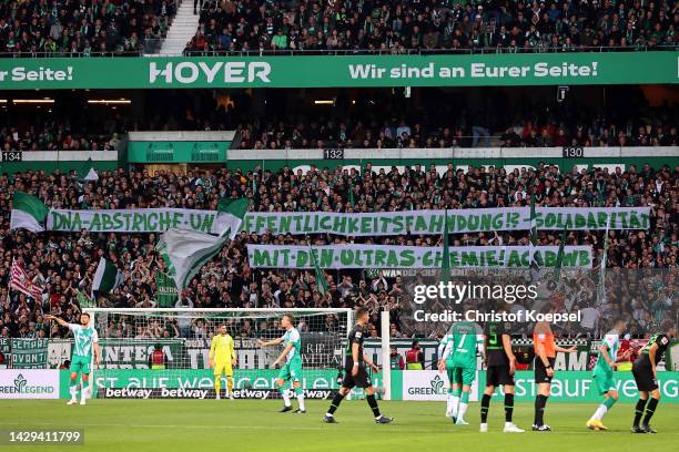 Werder Bremen fans show their support with banners during the Bundesliga match between SV Werder Bremen and Borussia Mönchengladbach at Wohninvest...