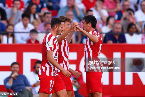 Marcos Llorente of Atletico de Madrid celebrates with teammates after scoring their team's first goal during the LaLiga Santander match between...