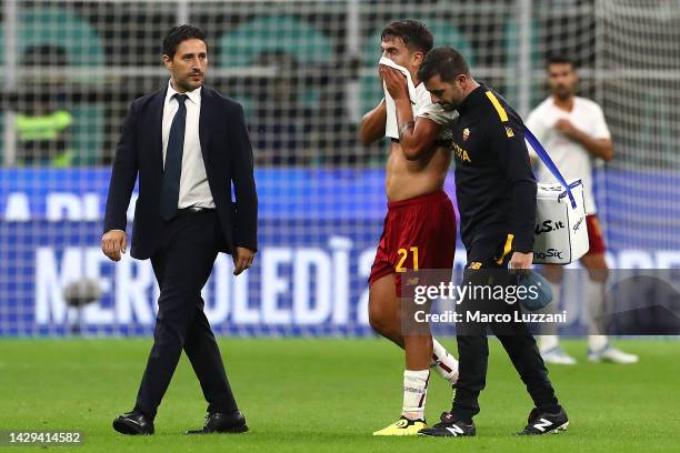 Paulo Dybala of AS Roma leaves the pitch after receiving medical treatment during the Serie A match between FC Internazionale and AS Roma at Stadio...