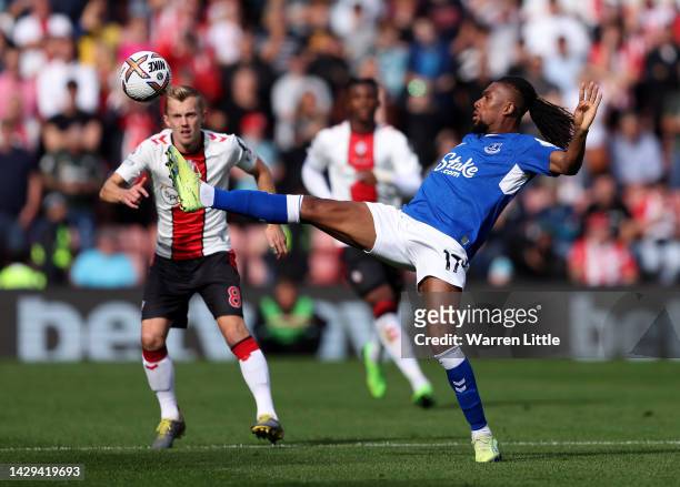 Alex Iwobi of Everton controls the ball while under pressure from James Ward-Prowse of Southampton during the Premier League match between...