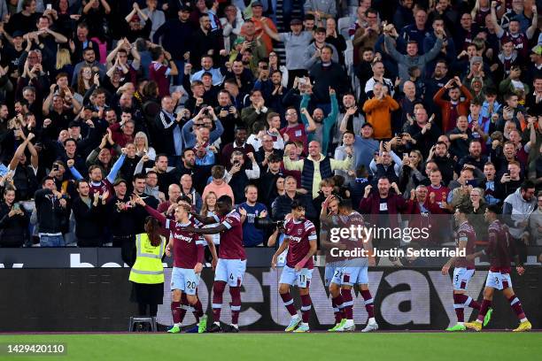 Jarrod Bowen of West Ham United celebrates with team mate Kurt Zouma after scoring their sides second goal during the Premier League match between...