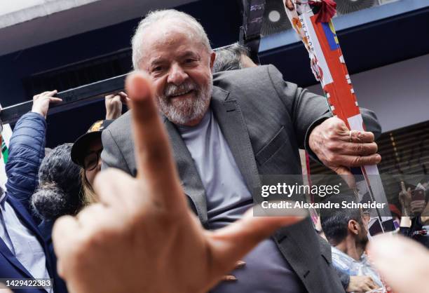 Former president of Brazil and Candidate of Worker’s Party Luiz Inácio Lula Da Silva smiles to a supporter during the closing rally of the...