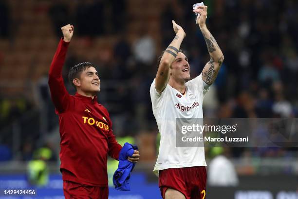 Paulo Dybala and Nicolo Zaniolo of AS Roma applaud the fans following their side's victory the Serie A match between FC Internazionale and AS Roma at...