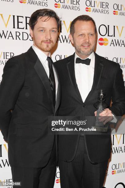 Presenter James McAvoy and Rob Ashford, winner of Best Revival for "Anna Christie" pose in the press room during the 2012 Olivier Awards at The Royal...