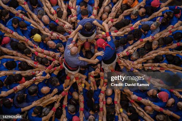 Members of the colla 'Castellers de la Vila de Gracia' build a human tower during the 28th Tarragona Competition on October 1, 2022 in Tarragona,...