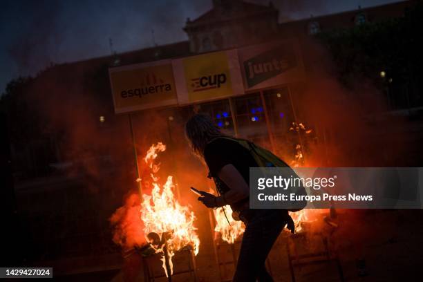 Demonstrators burn three chairs, representing the three pro-independence parties after the demonstration to commemorate the 5th Anniversary of the...