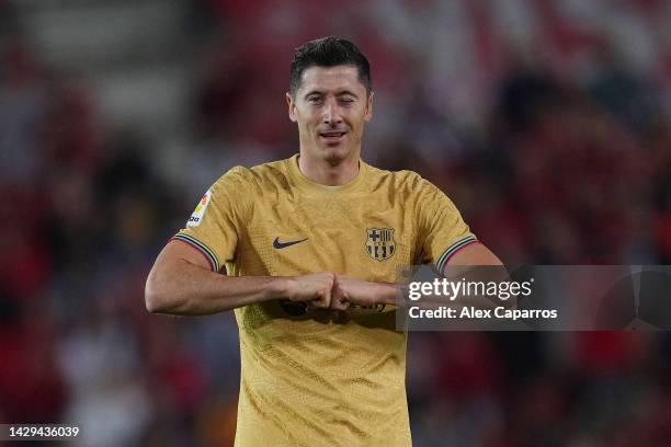 Robert Lewandowski of FC Barcelona celebrates after scoring their team's first goal during the LaLiga Santander match between RCD Mallorca and FC...