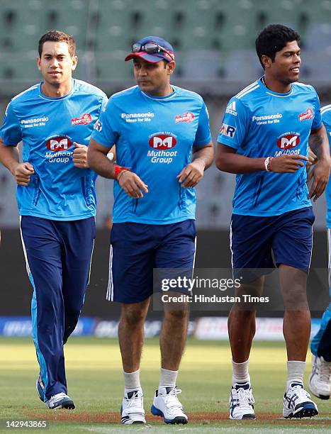 Delhi Daredevils players Ross Taylor, Virender Sehwag and Umesh Yadav jog during the practice section at Wankhede Stadium on April 15, 2012 in...