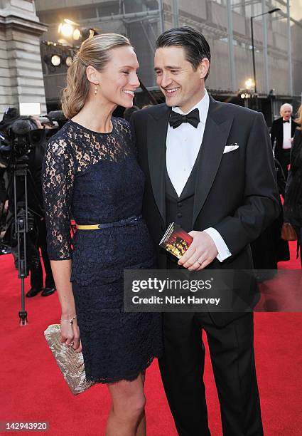 Tom Chambers and his wife Clare Harding arrive at the Olivier Awards 2012 at The Royal Opera House on April 15, 2012 in London, England.