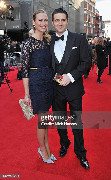 Tom Chambers and his wife Clare Harding arrive at the Olivier Awards 2012 at The Royal Opera House on April 15, 2012 in London, England.