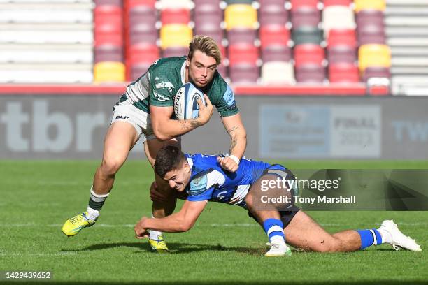 Ollie Hassell-Collins of London Irish is tackled by Orlando Bailey of Bath Rugby during the Gallagher Premiership Rugby match between London Irish...