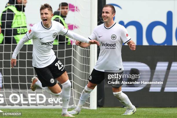 Jesper Lindstroem of Eintracht Frankfurt celebrates with team mate Mario Götze after scoring their sides second goal during the Bundesliga match...