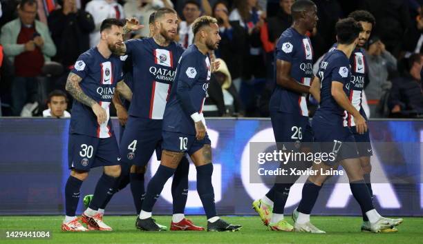 Lionel Messi of Paris Saint-Germain celebrate his goal with teammates during the Ligue 1 match between Paris Saint-Germain and OGC Nice at Parc des...