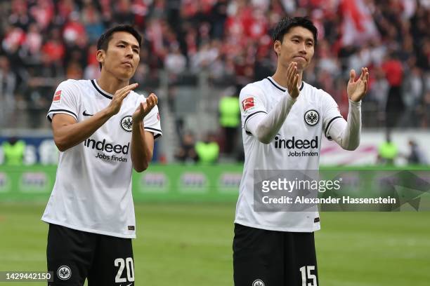 Makoto Hasebe of Eintracht Frankfurt and his team mate Daichi Kamada celebrate after winning the Bundesliga match between Eintracht Frankfurt and 1....