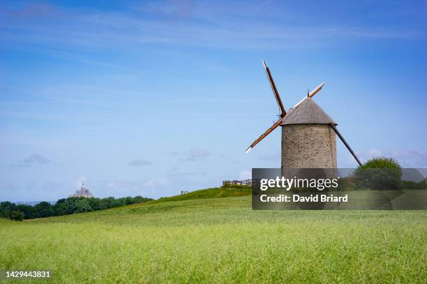 windmill and mont saint-michel - molino de viento tradicional fotografías e imágenes de stock