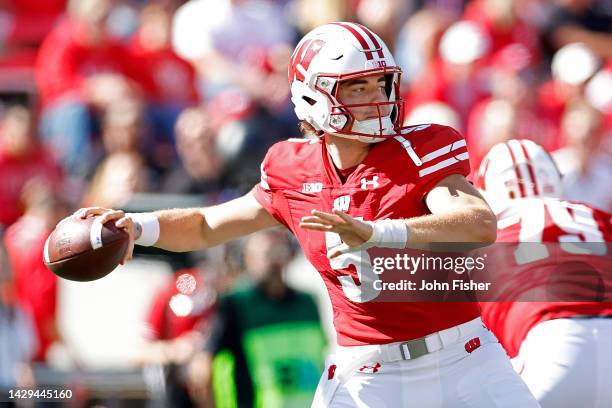 Graham Mertz of the Wisconsin Badgers throws a pass in the fourth quarter against the Illinois Fighting Illini at Camp Randall Stadium on October 01,...