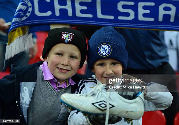 Young fans celebrate with John Terry of Chelsea's boot after victory in the FA Cup with Budweiser Semi Final match between Tottenham Hotspur and...